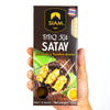 Siam Satay BBQ Kit packaging held by a hand on a white background